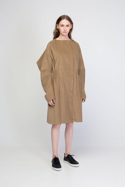 Beige corduroy transformer jacket with rectangle sleeves and gathering.